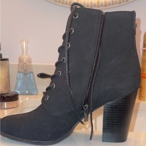 Women’s black velvet heeled boots.